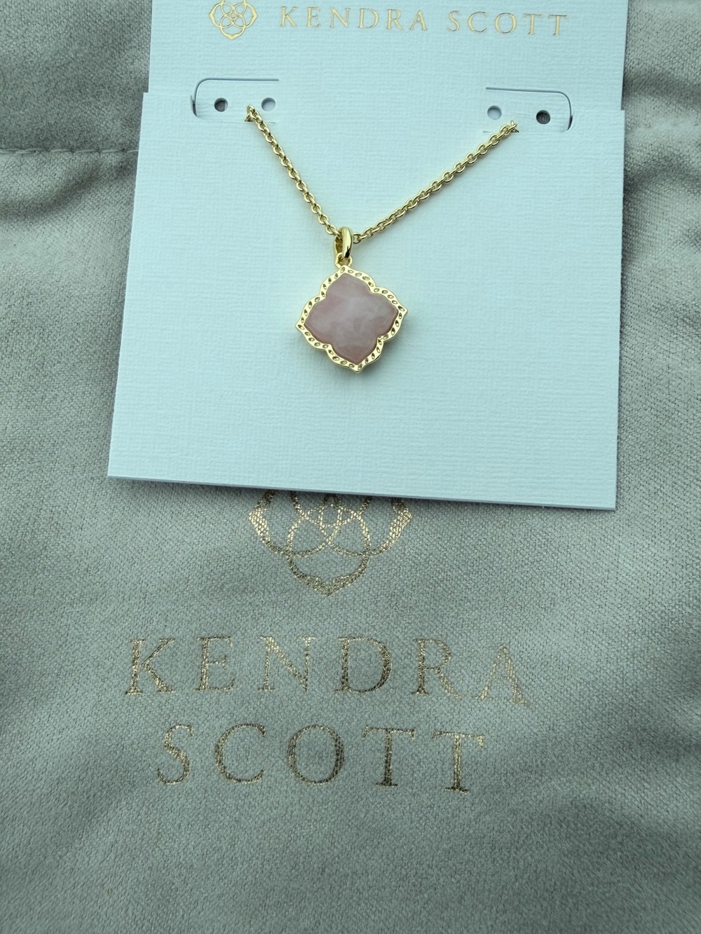 Kendra Scott Gold Necklace with Pale Pink Quatrefoil Pendant